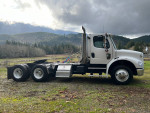 2007 Freightliner M2 truck with new parts and 365,000 miles parked in a scenic landscape