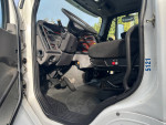 Interior view of a 2007 Freightliner M2 with modern features and controls, showcasing seating and dashboard.