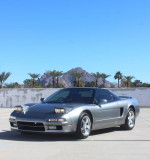 1991 Acura NSX with 31k miles, silver exterior, parked with palm trees and mountains in the background.