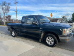 1997 Mazda B4000 pickup truck with 89,000 miles, parked on the street, showcasing its reliable condition.