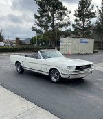 1965 Ford Mustang Convertible A Code 289V8 in great condition, parked outdoors with a power convertible top.