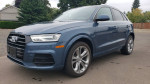 2017 Audi Q3 Quattro SUV in blue, showcasing its sleek design and excellent condition, with 67,000 miles.