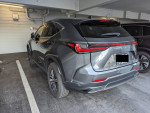 2023 Lexus NX 350h AWD parked in a garage, showcasing its sleek design and luxury features.