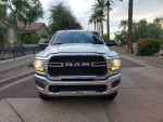 Front view of a 2021 Ram 2500 Tradesman 4WD in Scottsdale, Arizona, showcasing its chrome grille and headlights.