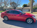 2009 Infiniti G37 sedan in red parked outside, showcasing its sleek design and premium features.