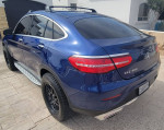 Elevated blue Mercedes-Benz GLC Coupe with sleek design and off-road capabilities for sale.