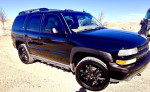 2005 Chevrolet Tahoe LS 4WD with custom wheels and sunroof, for sale, 70,000 miles, well-maintained SUV.