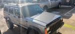 1993 Jeep Cherokee 4X4 in Gunmetal Gray with cargo rack and upgraded stereo system