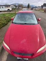 Front view of a 2000 Honda Accord LX in red color with manual transmission for sale.