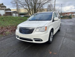 2013 Chrysler Town and Country minivan in white, low mileage, clean title, parked on a rural road
