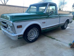 1972 GMC C10 pickup truck with original short bed, V8 engine and unique green and white paint job.