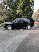 2009 GMC Yukon SUV with 129,000 miles, well maintained, family-friendly, parked outdoors