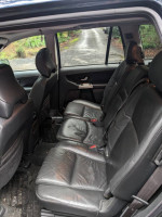 Interior view of a 2004 Volvo XC90 showing well-maintained rear leather seats
