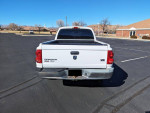 Rear view of a well-maintained 2005 Dodge Dakota SLT Quad Cab V8 parked in an empty lot.