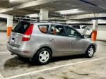 2012 Hyundai Elantra Touring in a parking garage, showcasing its clean exterior and roof racks.