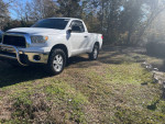 2007 Toyota Tundra SR5 4WD with new tires and stainless brush guard parked on grass