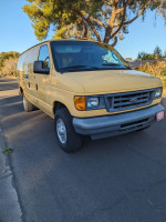 2007 Ford Ecoline cargo van in great condition, ready for work, parked on a sunny street.