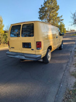 Used 2007 Ford Ecoline cargo van in great condition parked on the street.