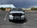 Front view of a 2005 Ford FX4 4X4 truck with oversized tires and leveling kit in a parking lot.