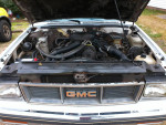Engine bay view of a well-maintained 1982 GMC S-15 Sierra Classic pickup truck.