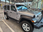 2019 Jeep Wrangler Sport 4WD with low mileage, leather seats, and hardtop, displayed in excellent condition.